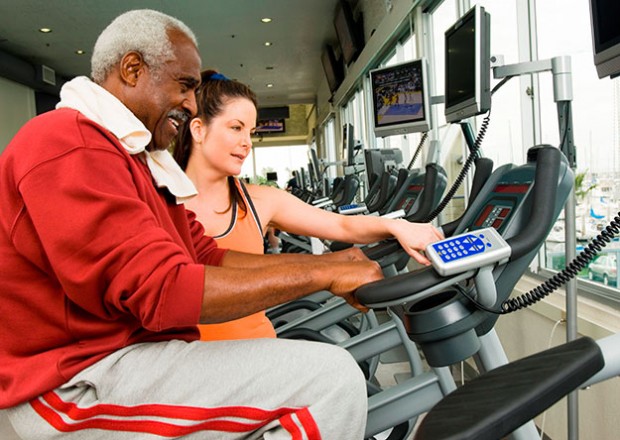 A stroke survivor does physical therapy on a motorized staionary bike.